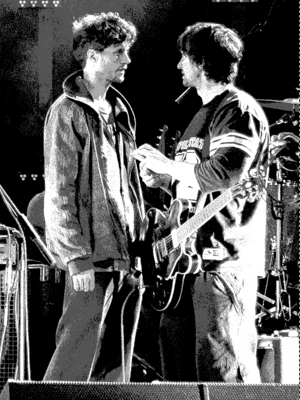Martin and Grippa on stage, posterised black-and-white photograph